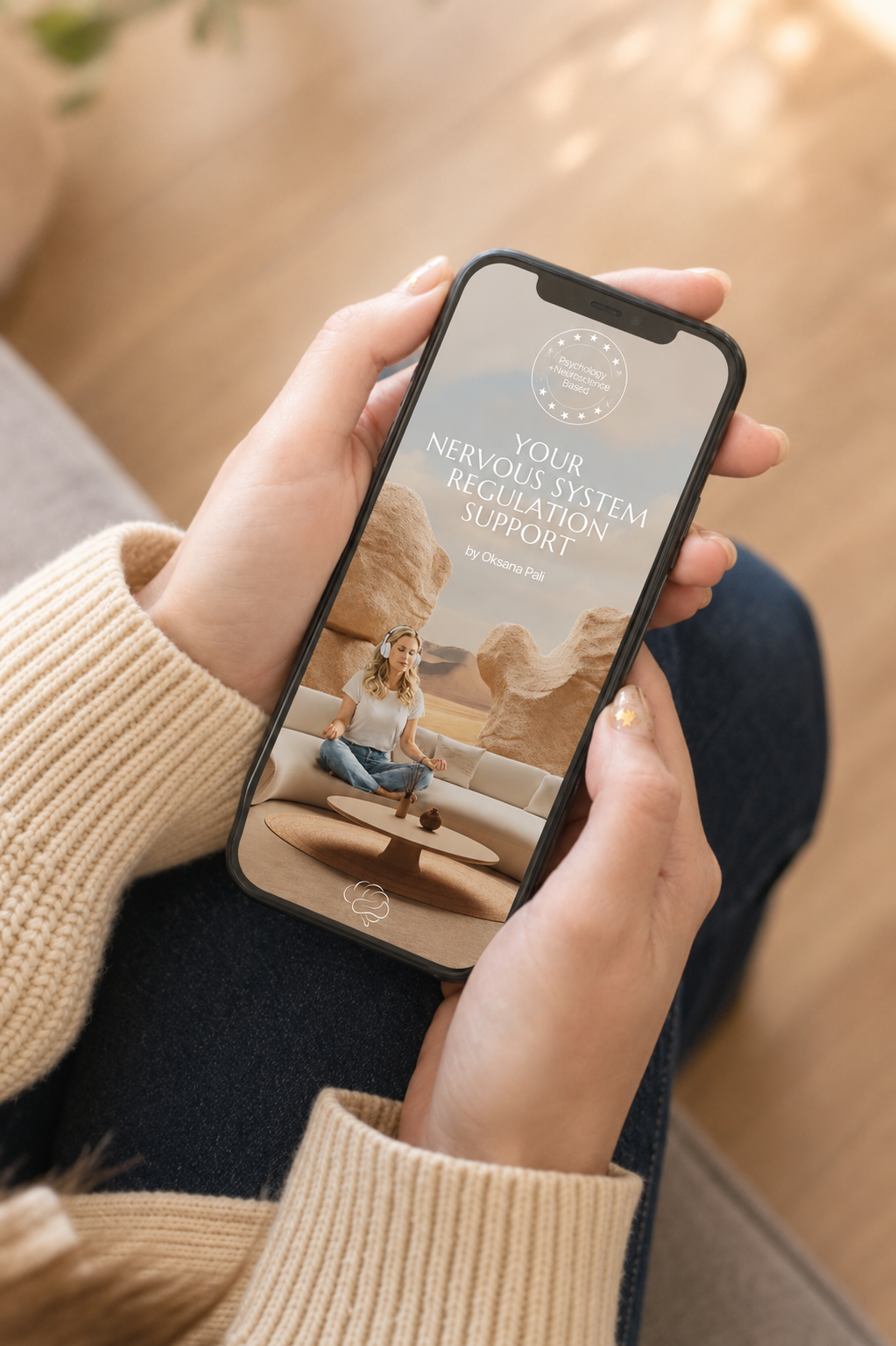 Woman holding a phone showing the Nervous System Regulation Support app